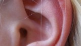 Why do I sometimes hear ringing in my ears, especially when I drink alcohol?